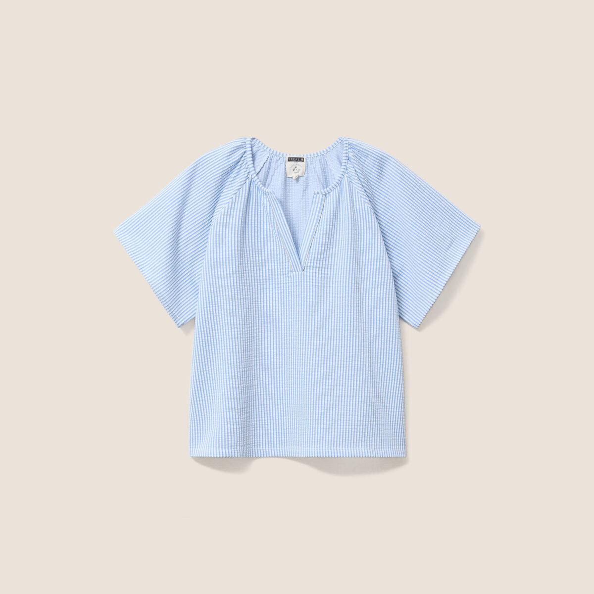 Blouse courte bas resserr&eacute; bleu femme